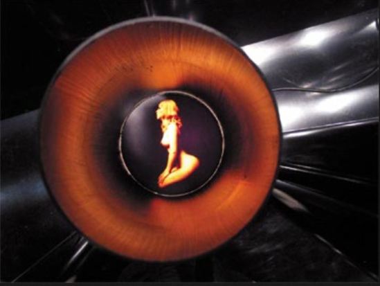 the polaroid of carlo mollino is presented inside the metal tube for the expossition Mollino fragments, Triennale de Milan, 2005