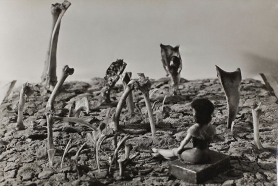 Jindřich Heisler, Untitled [Seated doll and bones], c. 1944.