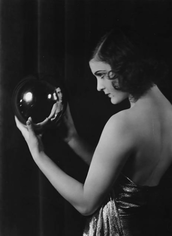 Marika Rokk looking into a crystal ball.1930 by sasha